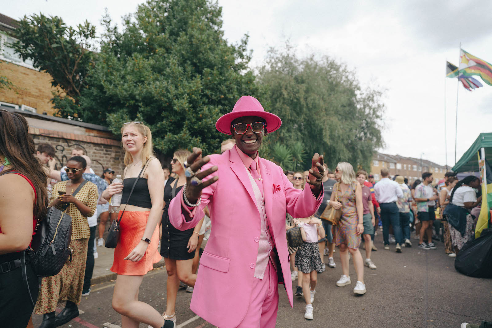 A man in a bright pint suit at Notting Hill Carnival 2022