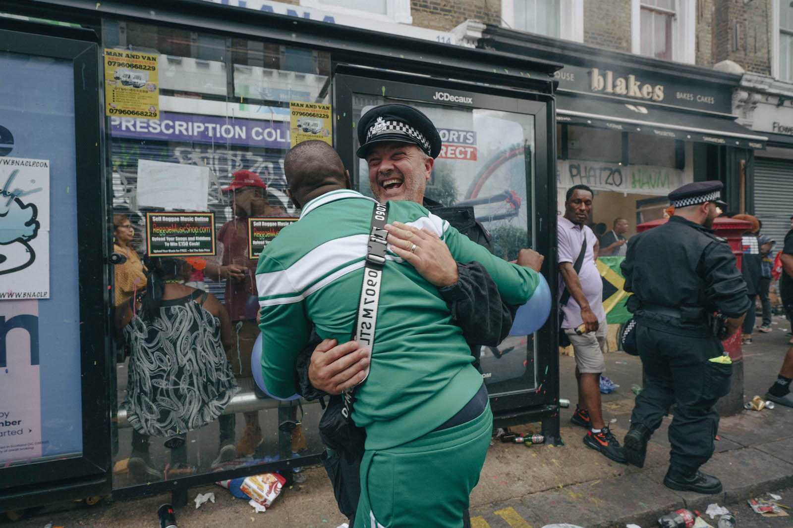 A man hugging a policeman at at Notting Hill Carnival 2022