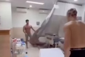 shirtless-man-trashes-medical-clinic-in-wild-video